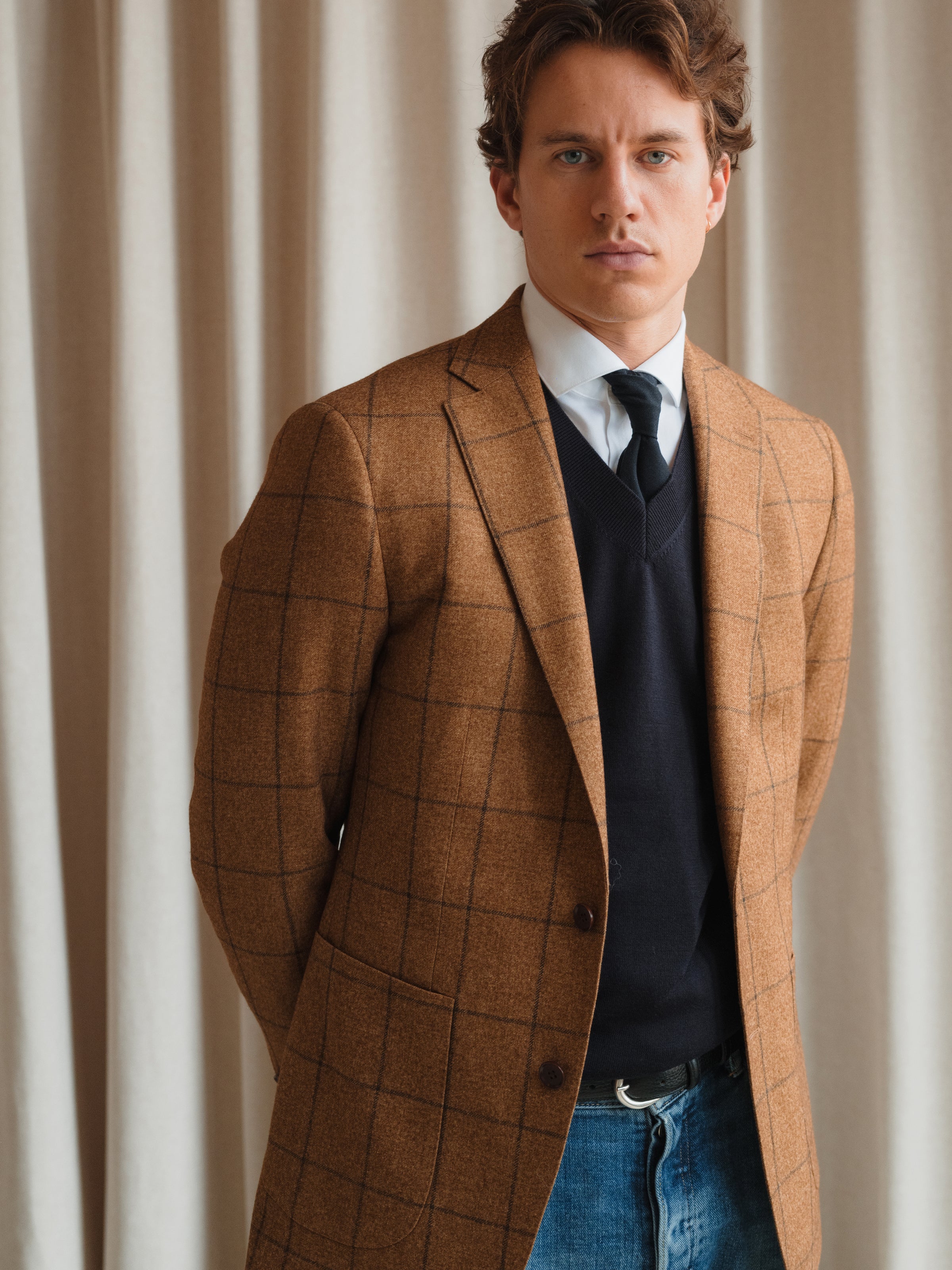 Luxury suits in an array of styles, from refined solids to subtle and bold patterns, at Atelier ACÀN in Ghent and Antwerp.