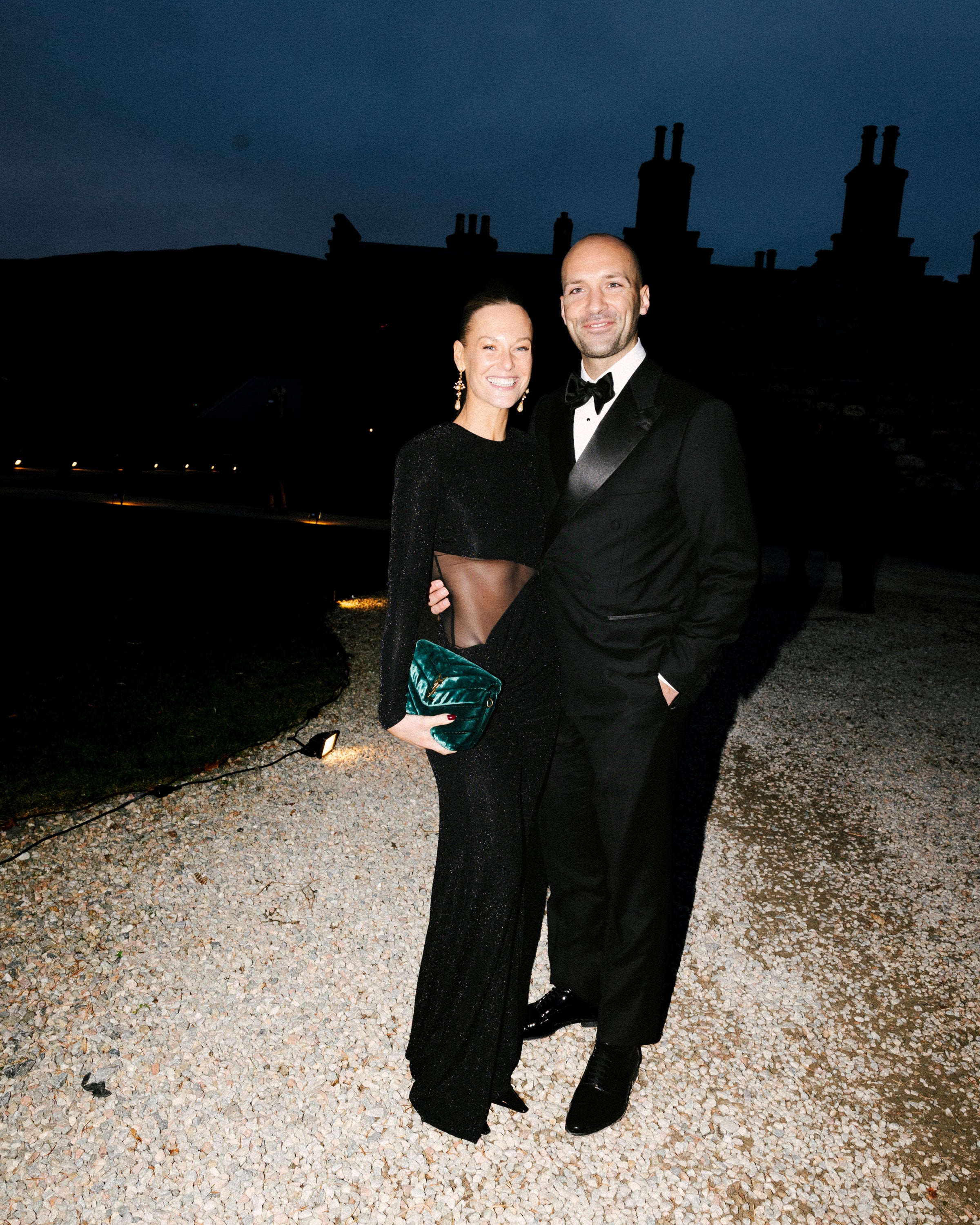 Newlywed couple celebrating, groom in a handcrafted Atelier ACÀN tuxedo. Client stories at Atelier ACÀN.