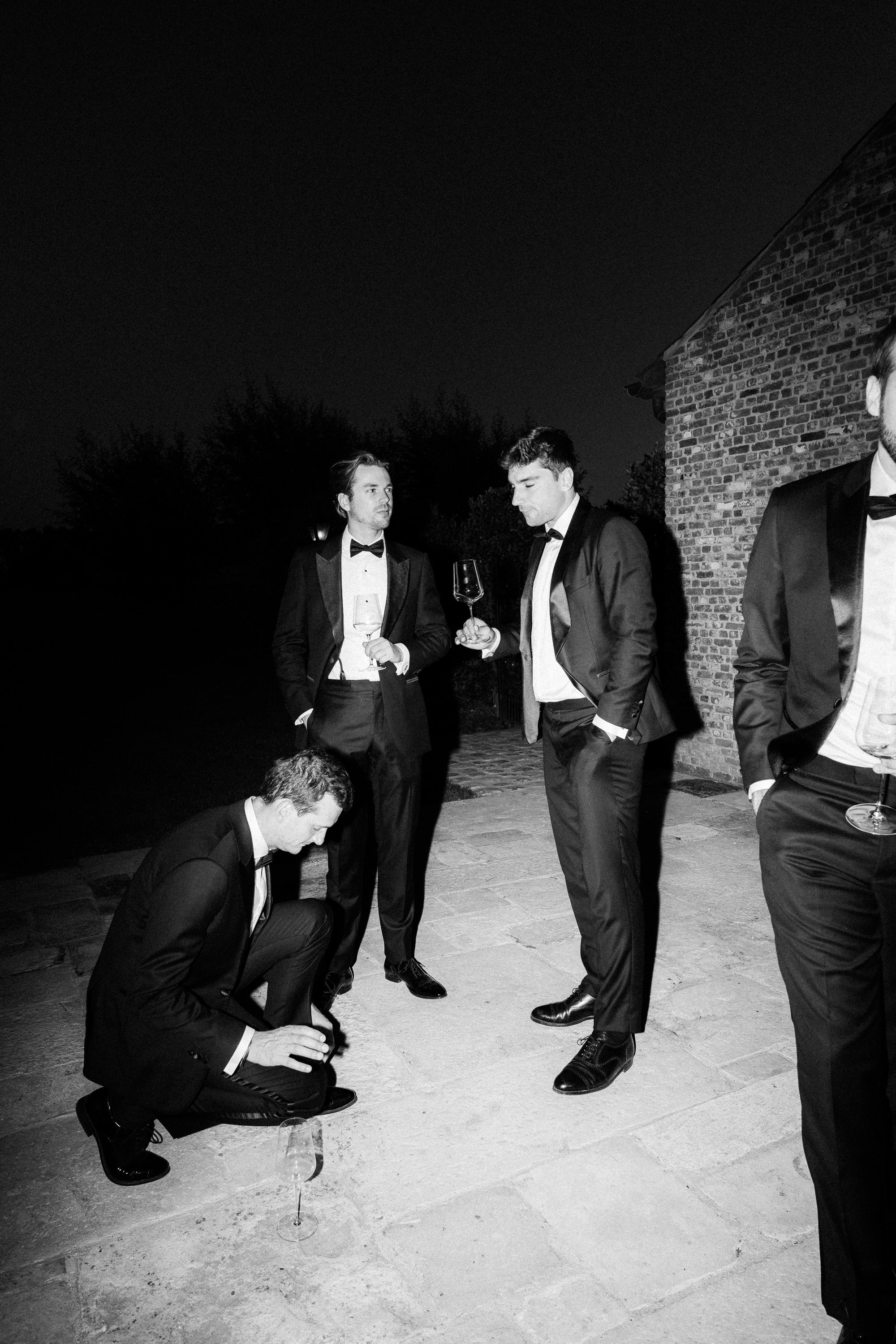 groomsmen in tuxedo black tie smoking