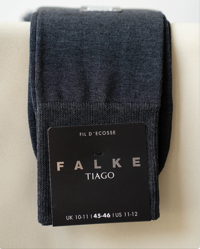 Dark gray Falke Tiago socks with brand label on a light background