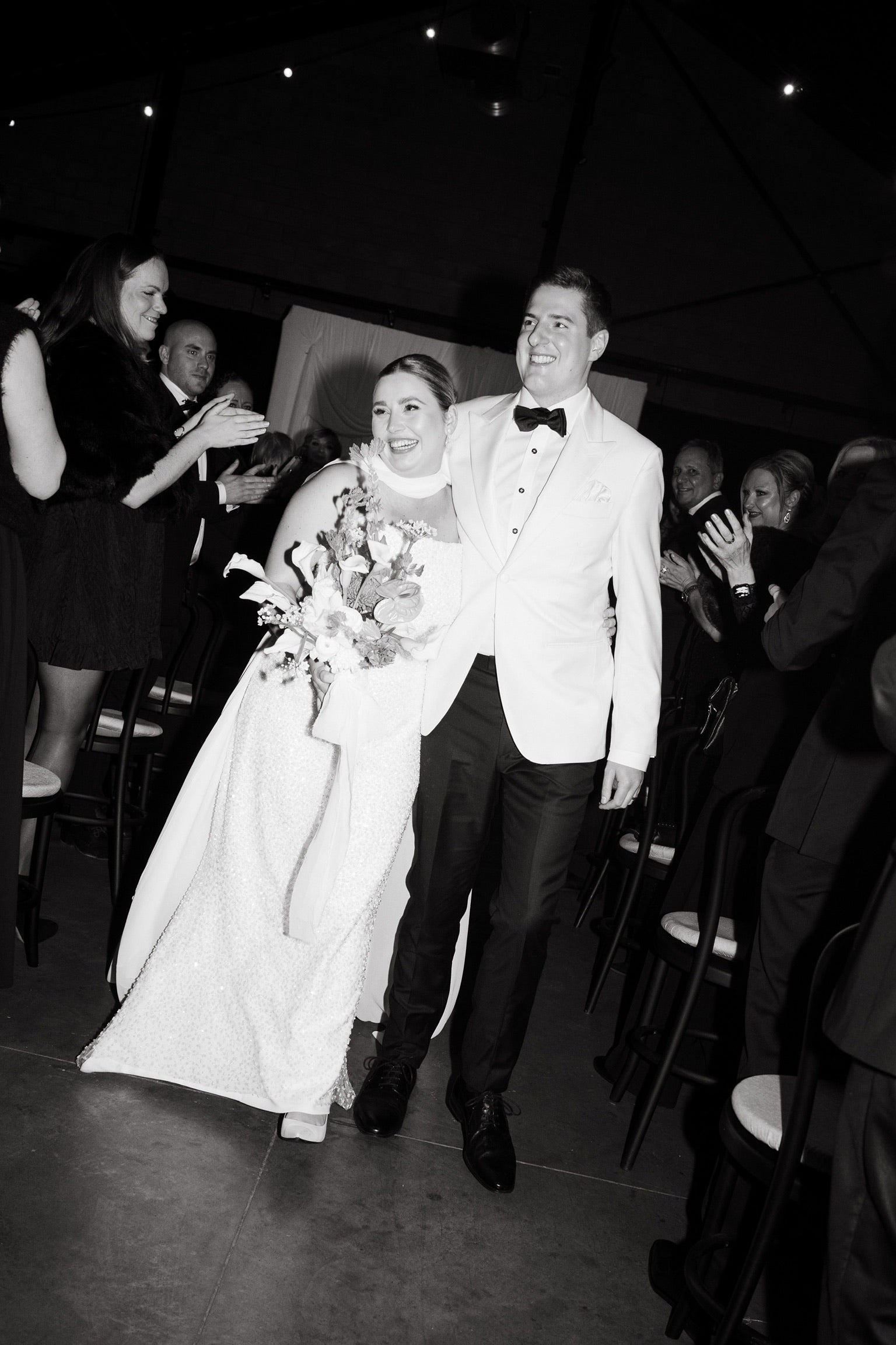 white cream tuxedo jacket with a black tie look, groomsmen