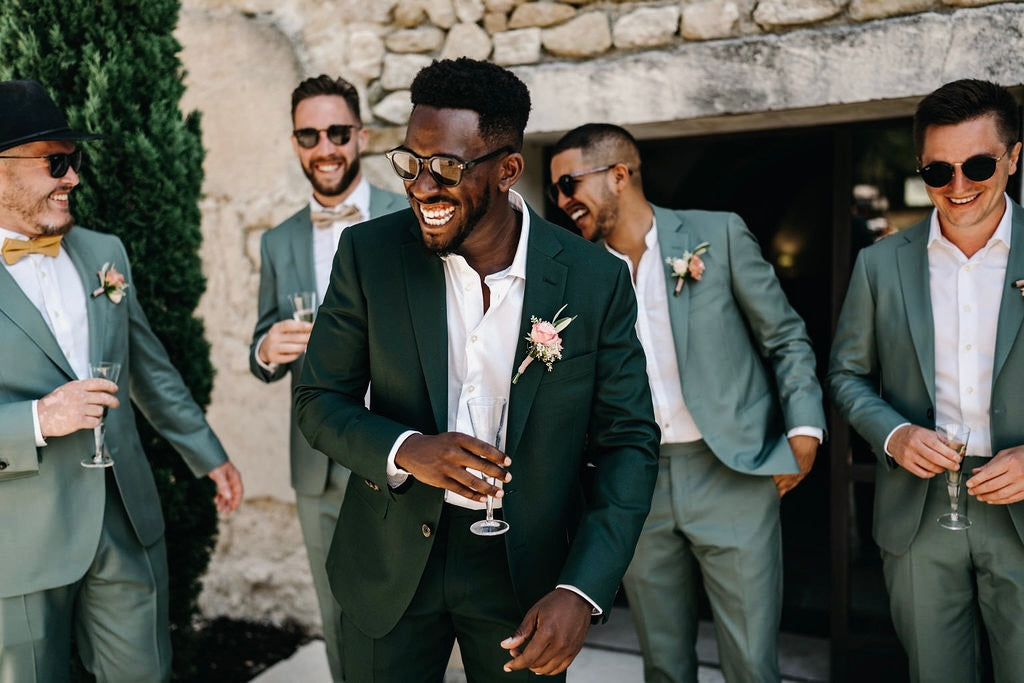 Elegant groomsmen in coordinated custom suits by Atelier ACÀN, perfect for a refined wedding aesthetic.
